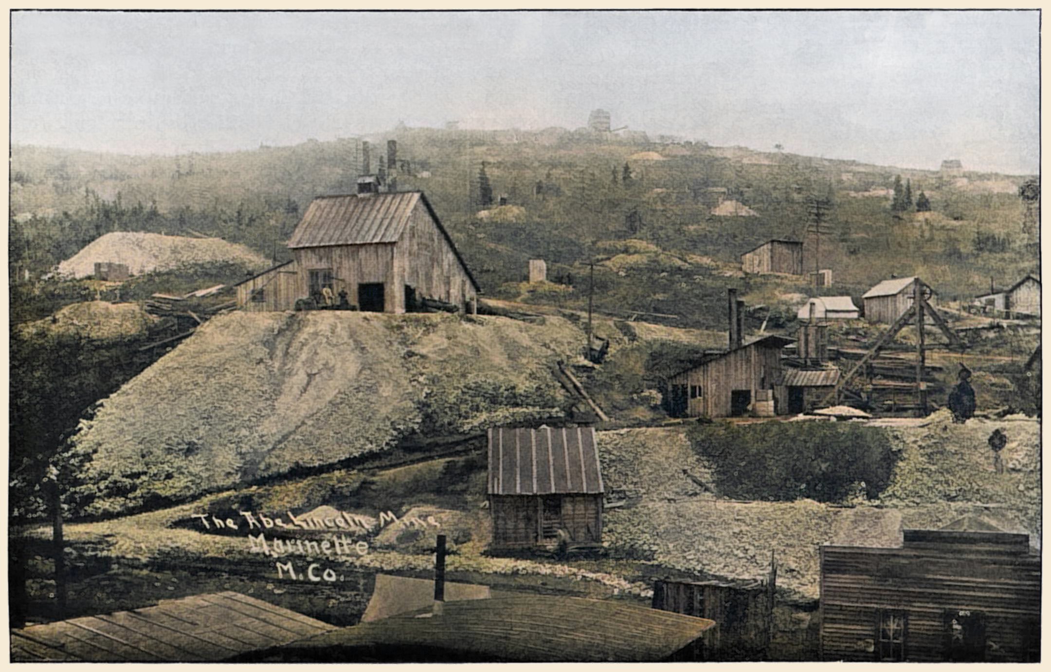This is an early view of the Abe Lincoln Mine in Poverty Gulch, at this time owned and operated by the Marinette Mining Company, organized by the Arnold brothers. The Abe Lincoln was located May 9, 1895 by E. S. Arnold, a United States deputy mineral surveyor, and his two brothers, Ralph R. and Joe C.
   This according to text in a book from 1896, which provided this image. Being such a source, the quality is not that great, but I think it came out as good as I can expect it. In this view there are two shafts, the one with the larger Shaft house which has filled out its own level ground out from the original ridge, seen about 1/3 in from left and top. And the No. 2 shaft, which is lower, smaller, has a Hoist house carved into the hillside and a visible Headframe, seen about 1/6 in from right-hand side. Situated between them, at bottom of Poverty Gulch is the Ore house, but soon there will be a bigger ore house directly linked to the main shaft house.
   In the foreground some of the houses, structures of Poverty Gulch are seen as roofs only and one front of a typical 'wild west' type belonging to some unknown business I assume. In the background is Gold Hill with lots of smaller dumps and at top the large Shaft house of the Anchoria-Leland is easy to recognize!
   I did procure the colored version of this image. Source was grayish, or in common speech black & white. Used an online service and tweaked and worked with image to get what looks best to my eyes at the moment.