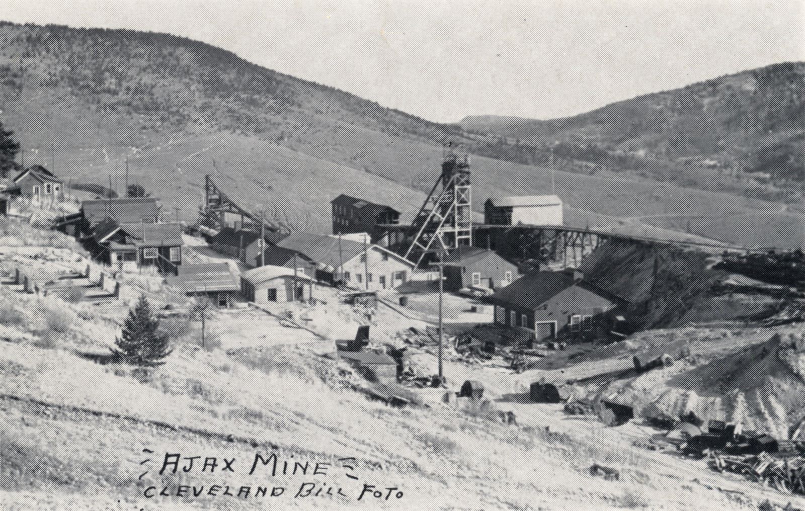 Actually, quite a nice view of the Ajax Mine area, I also have this an as photo from a Newspaper Archive, said to been photographed around January 1942. Not much to pick put in this view from the golden heydays when the massive mine structures dotted this area, and the railroads run in this area.
   I think about middle top/down on the left-hand side is the foundation for the Clancy/Ajax Mill, while the Ajax Headframe is easy enough to pick out just right of the center of the view.