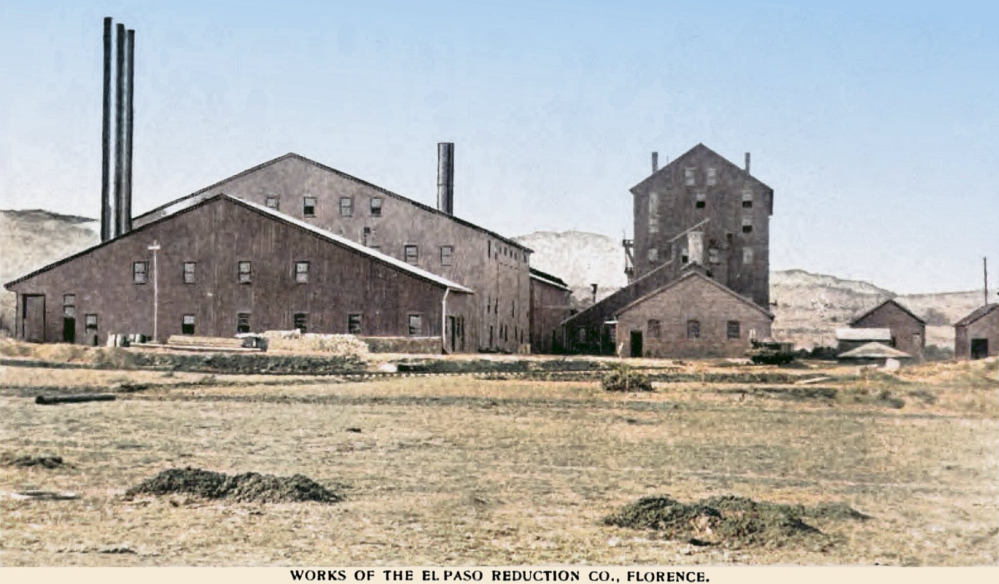 This sadly bad view of the El Paso Mill in Florence is one of very few known views of this mill that was located southeast of the town of Florence, and which was to treat gold ore from the Cripple Creek Mining District using the Chlorination Process.
   Judging from a 1900 Sanborn Fire Insurance Map and the fact this view appears in a 1898 book I think the direction of the view is looking west, and the main ore deliveries seems to have been outside the view at left, where the closest building at left is the Power Plant House for most part, and then the large high one is the Crusher and Dryer structure, followed by a structure holding Bedding Floors, Roasters and Cooling area. The high narrower structure more to the right is marked as being the Chlorination Building with a Belt House and Refinery more towards the photographer. Further right there is a Carpenter and Blacksmith shown as smaller structures, only half of the Blacksmith is visible.
   I did procure the colored version of this image. Source was gray-toned, or in common speech black & white. Used an online service and tweaked and worked with image to get what looks best to my eyes for the moment.