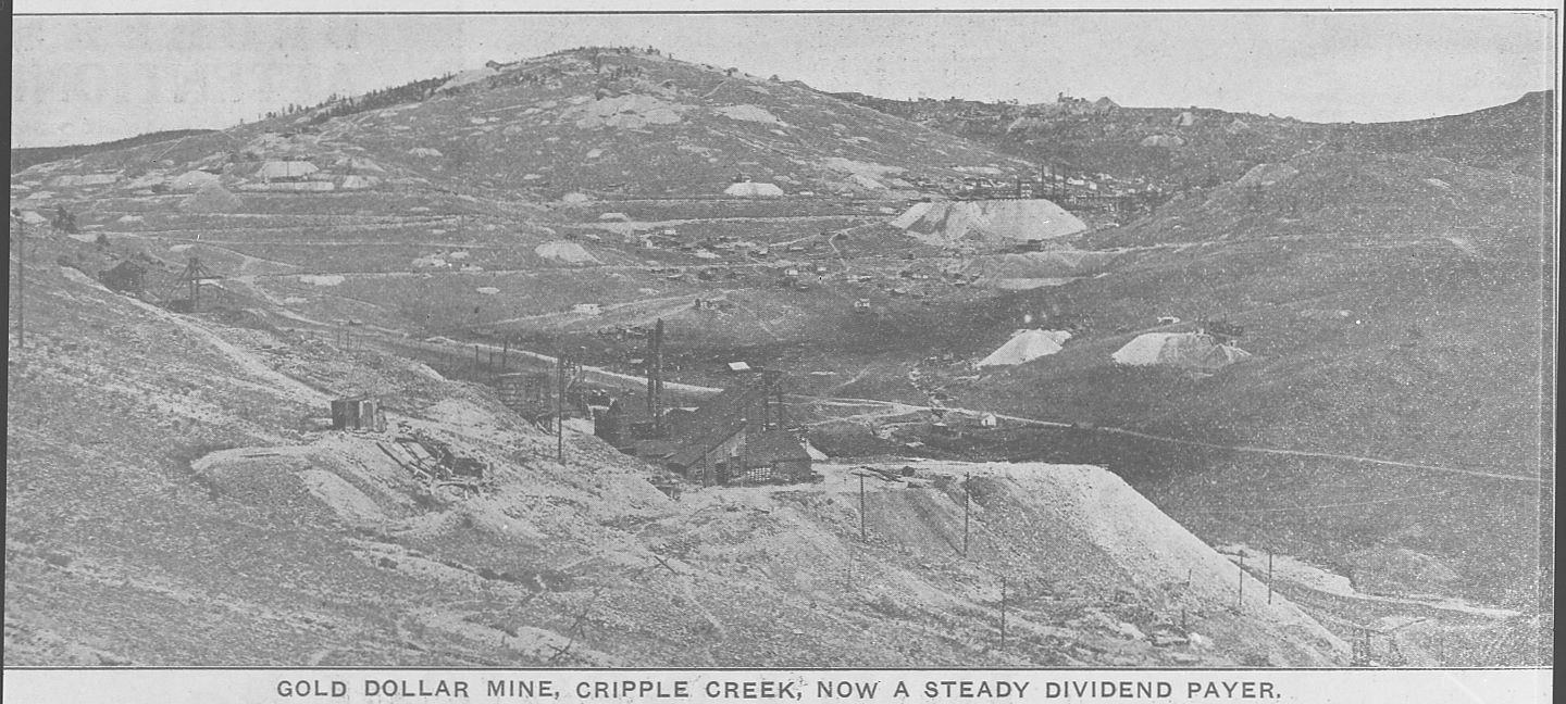 This view looking north east from a place just south and west for the surface structures of the Gold Dollar Mine on Beacon Hill, also shows the valley Arequa was in, with Guyot Hill prominent in the background and several other mines seen. But of course, I wish this was a true photograph, because then I would most likely been able to better get a view of the finer details lost in this view here. There are several things of interest, from a better look at the Gold Dollar in the foreground with its dump, to the Elkton Mine seen about 1/3 from top and about 1/3 in from right-hand side with its huge dumps, to the railroad lines running passed it, or many of the other mines hinted in this view. But sadly, this is what I have, where someone took a photo of a printed source somewhere, and I ended up getting my hand on that negative of that photo years later.