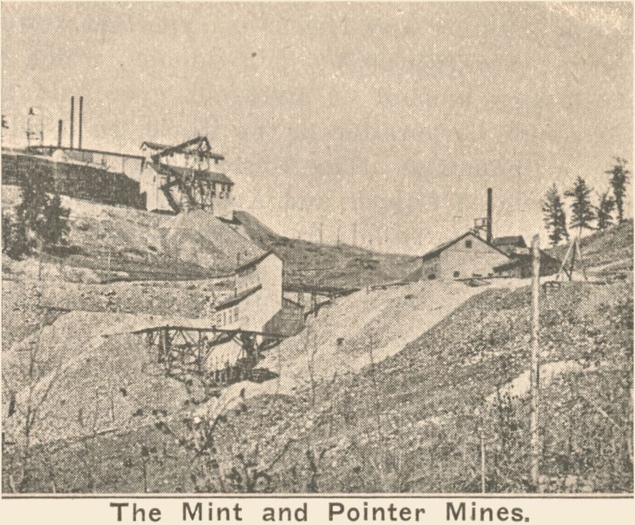 View of the Ore House and Shaft house of the Pointer Mine in foreground, with the Index Mine (former known as the Mint mine) in the left background. Between them is the Low Line roadbed.