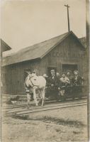 View of Mule with Tourist on Mine Passenger Car in Front of Shed/Portal to Cripple Creek Gold Hill Deep Mining and Development Company's Gold Hill Tunnel 2